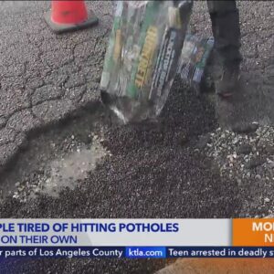 Couple tired of hitting potholes in Compton is now filling them on their own