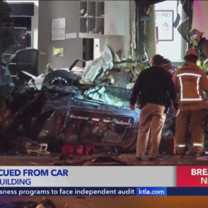 Car slams into side of building, overturns in Pomona