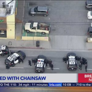Man armed with chainsaw in standoff with police