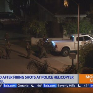 Man arrested after firing shots at police helicopter 