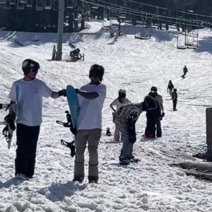 Spring skiers and snowboaders hit the slopes