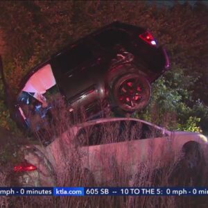 SUV ends up on top of sedan after wild crash on 91 Freeway 
