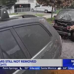 Charred cars in Harvard Heights still not removed