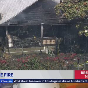Residents treated outside Koreatown home burned in fire