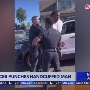 LAPD officer punches handcuffed man