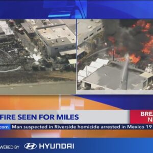 Massive fire at commercial facility visible for miles across L.A. area.