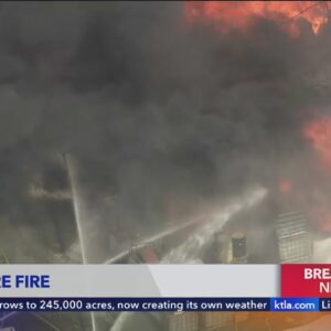 Massive structure fire erupts east of Los Angeles