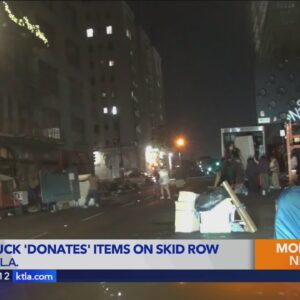 Moving truck full of furniture unloaded onto Skid Row
