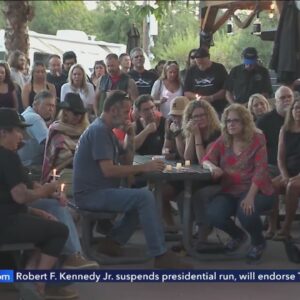 Candlelight vigil honors victims of deadly shooting at Cook's Corner bar