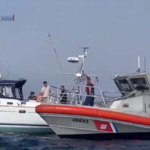 Sailboat helps rescue man who feel overboard on a motor boat with engine trouble