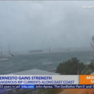 Ernesto regains hurricane strength, sends massive swells to East Coast