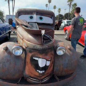 New car show called Wheels and Waves rolls into local harbor parking lot