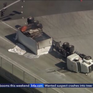 Workers clearing burned-out semi from San Pedro freeway