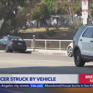 LAPD motorcycle officer struck by vehicle in Chinatown