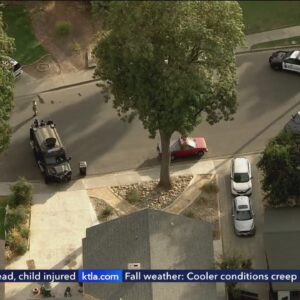 Police surround L.A. County home as they search for suspects in deadly shooting