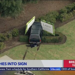 Driver slams into cemetery sign