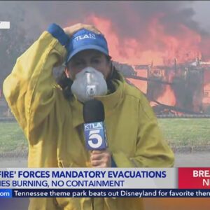 Homes go up in flames during reporter's live shot