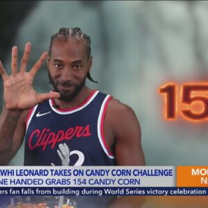 Kawhi Leonard grabs 154 candy corn with one hand 