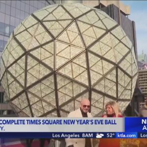 Singer Pitbull helps install final crystal triangles on Times Square ball ahead of New Year's Eve