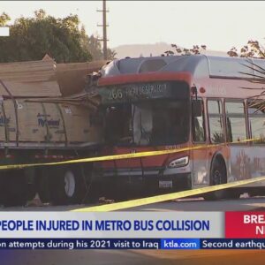 Metro bus slams into lumber truck; 12 hurt