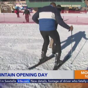 Skiers and snowboarders celebrate opening day at Bear Mountain