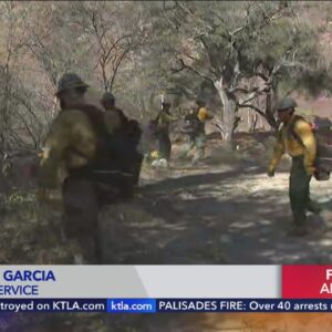 Fire crews from U.S. Forest Service clear brush in anticipation of increased fire activity