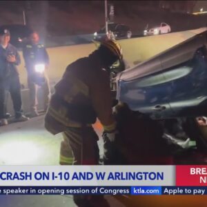 Video shows first responders extricating man from rollover wreck on Los Angeles freeway 