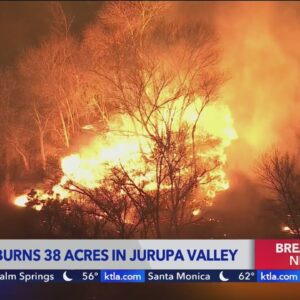 Brush fire ignites in Jurupa Valley, threatening structures