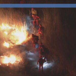 Crews seen working on brush fire northeast of L.A.