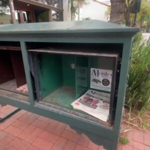 Damages and abandoned newspaper racks coming out