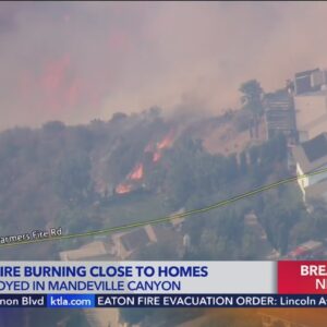 Massive flames approach Brentwood homes