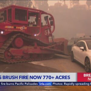 Palisades Fire: Bulldozer moves cars blocking road