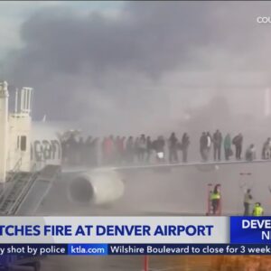 12 taken to hospital after plane catches fire at Denver airport