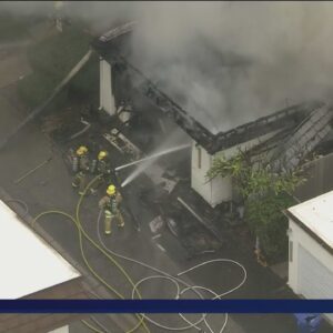 Smoke pours from Chatsworth townhome as firefighters attack blaze